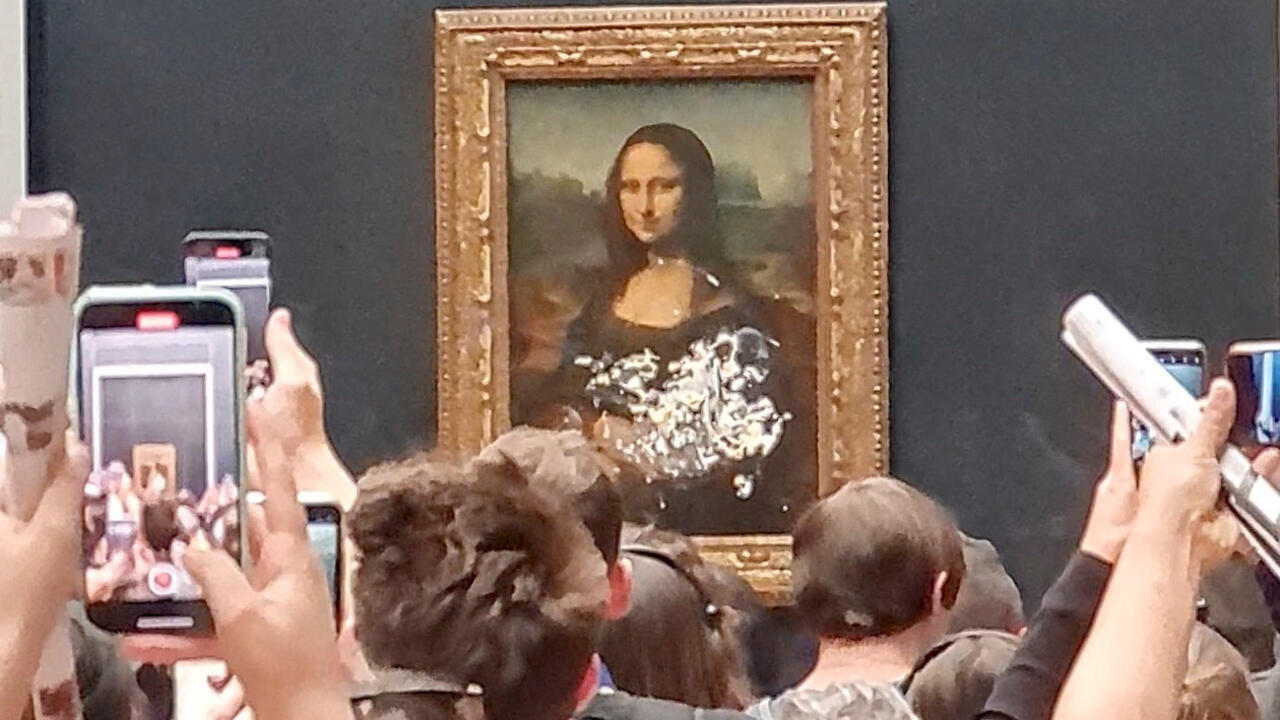 Paris Man disguised as old woman throws cake at the Mona Lisa France 24